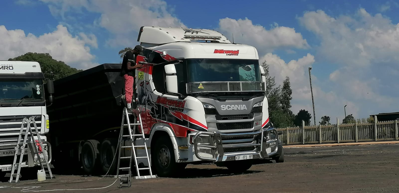 Commercial Scania truck cab vinyl wrap installation on site by Signage 4 Africa
